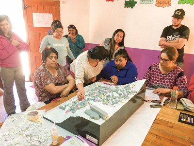 Workshop with local people sharing knowledge about the neighborhood, Barrio Cantera, an informal settlement with land slide risk in San Martín de los Andes, Argentina, October 2017.